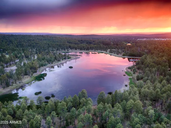 an aerial view of a houses with a yard