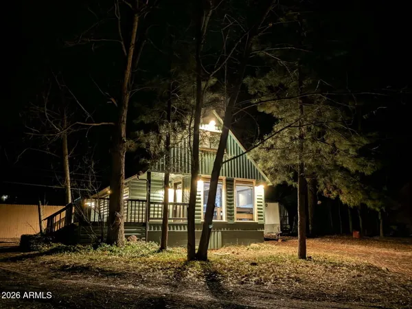 a tree in front of a house