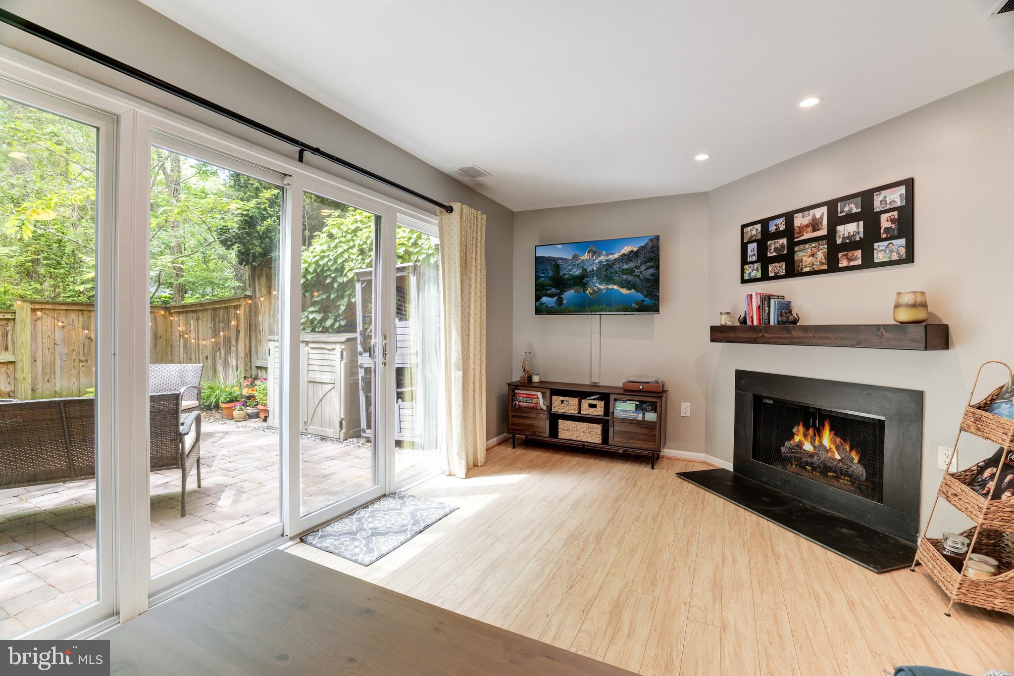11340 Headlands Court Reston, VA 20191 - Photo 23 of 31 Living room features wood-burning fireplace