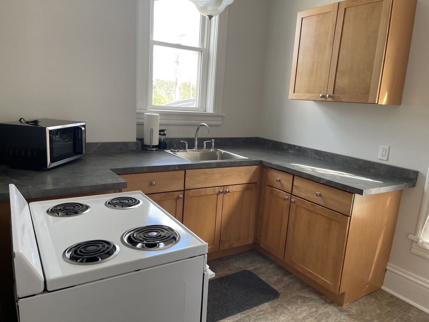 718 Columbus Street Ottawa, IL 61350 - Photo 9 of 23 a kitchen with a cabinets and white appliances