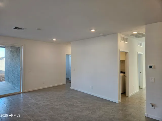 a bathroom with a shower and a glass door