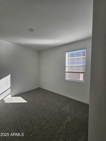 a bathroom with a double vanity sink a toilet and a large mirror