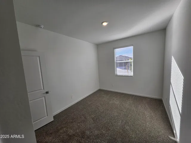 a large kitchen with granite countertop a stove a sink and a granite counter top