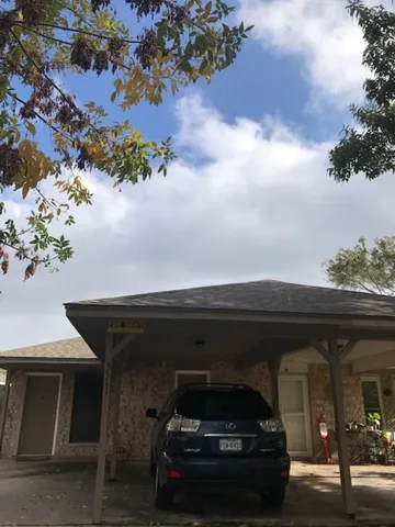 a car parked in front of a house