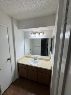 a white toilet sitting next to a shower