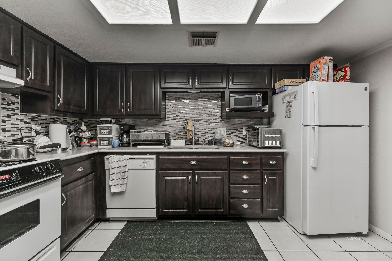 721 North Balsam Street Ridgecrest, CA 93555 - Photo 5 of 16 a kitchen with refrigerator and cabinets