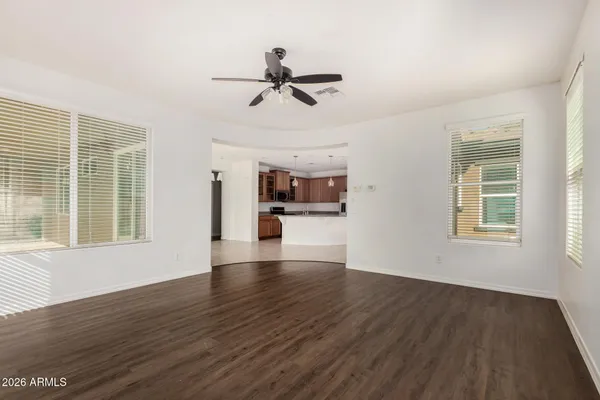 a view of a room with a ceiling fan
