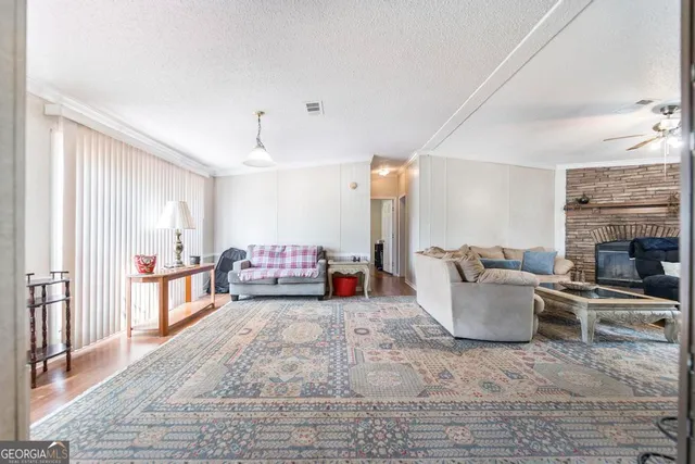 a living room with furniture and a fireplace