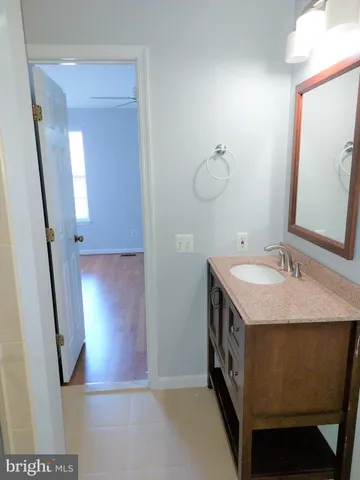 a bathroom with a double vanity sink and mirror