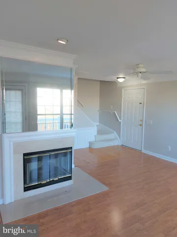 a view of empty room with a fireplace