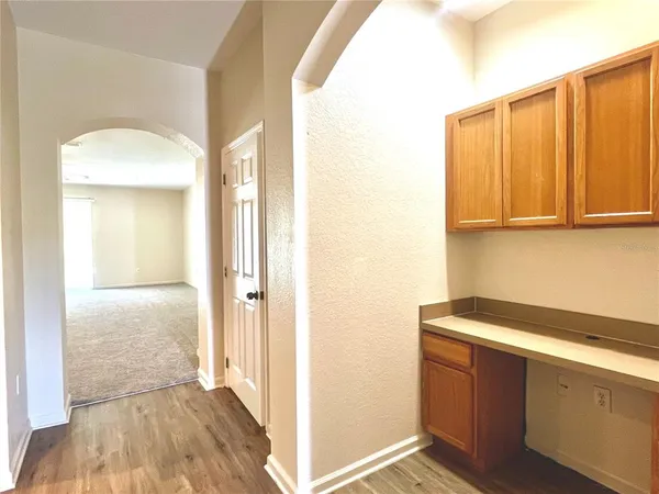 a view of an entryway with wooden floor