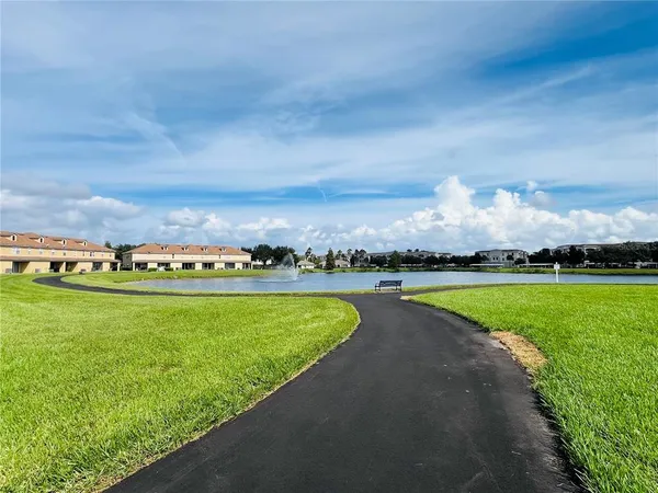 a view of a lake with houses in the back