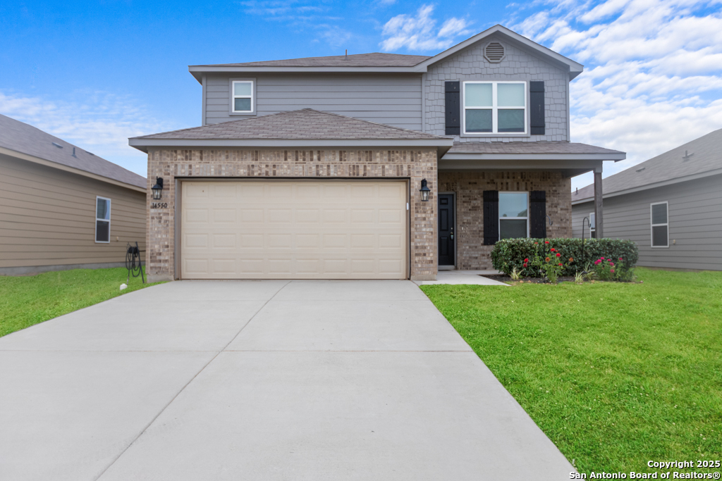 14550 Open Range Road Lytle, TX 78052 - Photo 1 of 1 a front view of house with yard and green space