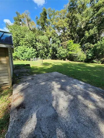 a view of backyard with green space