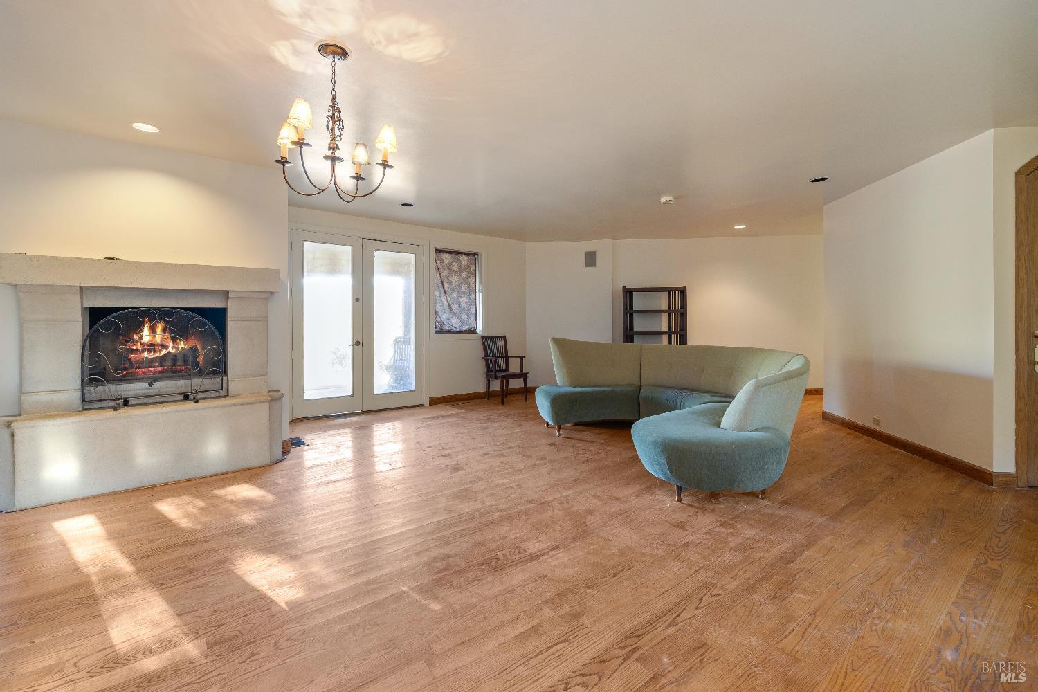 3295 Warm Springs Road Glen Ellen, CA 95442 - Photo 18 of 37 a living room with fireplace furniture and a chandelier