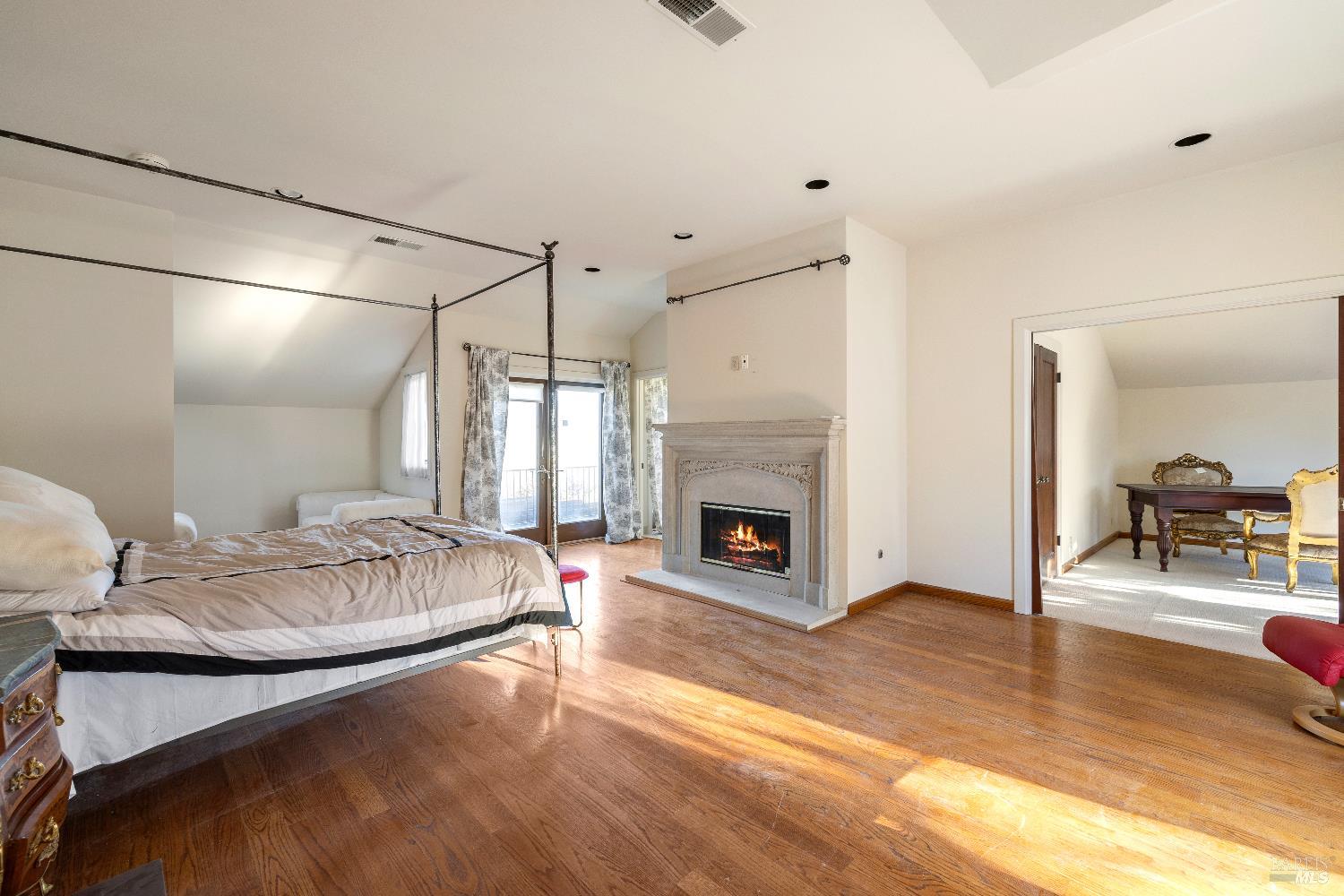 3295 Warm Springs Road Glen Ellen, CA 95442 - Photo 27 of 37 a spacious bedroom with a bed and a fireplace