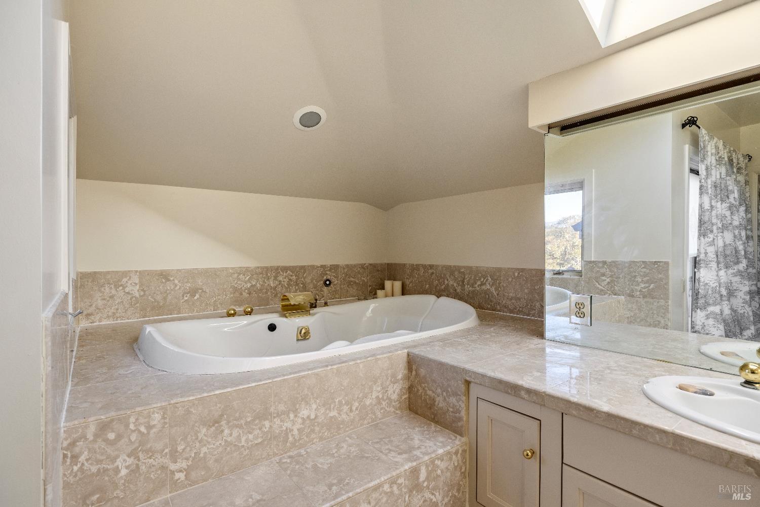 3295 Warm Springs Road Glen Ellen, CA 95442 - Photo 28 of 37 a bathroom with a tub sink and mirror