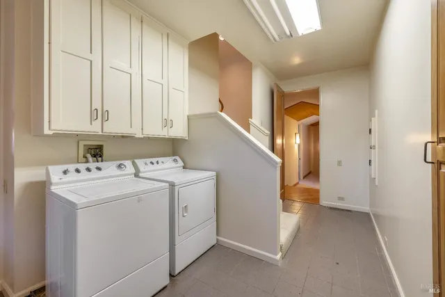 a building outdoor space with patio furniture and potted plants
