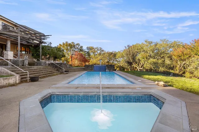 a view of a swimming pool with an outdoor seating