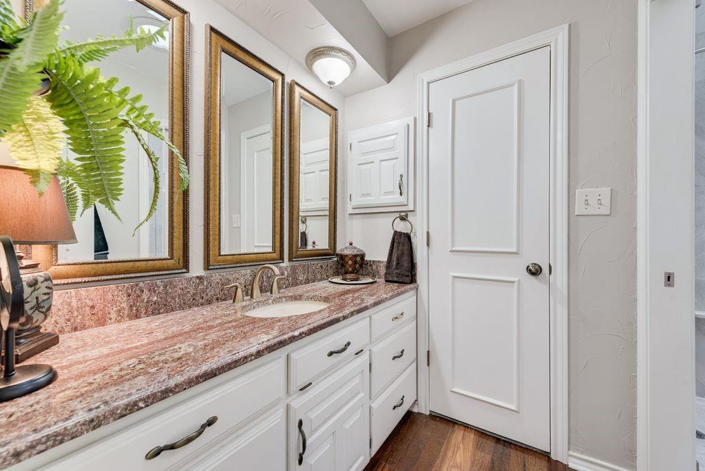 802 Riva Ridge Wylie, TX 75098 - Photo 22 of 39 a bathroom with a granite countertop double vanity sink and mirror