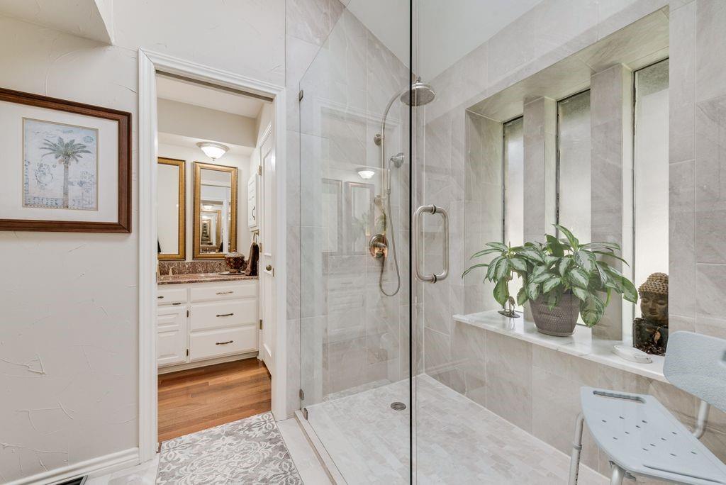 802 Riva Ridge Wylie, TX 75098 - Photo 23 of 39 a bathroom with a shower sink and mirror