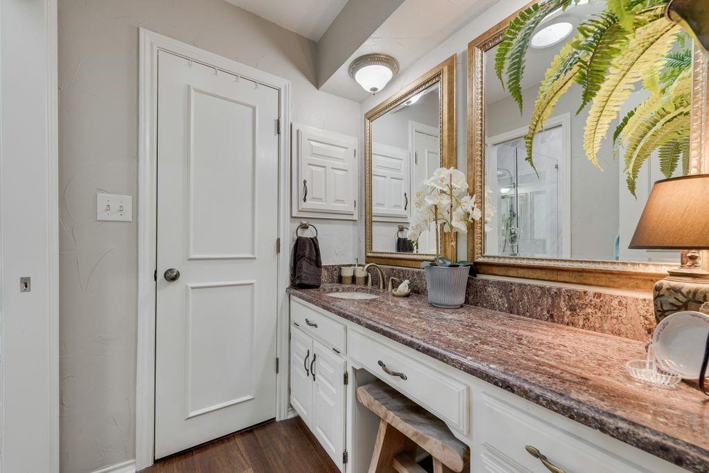 802 Riva Ridge Wylie, TX 75098 - Photo 24 of 39 a spacious bathroom with a granite countertop sink and a mirror