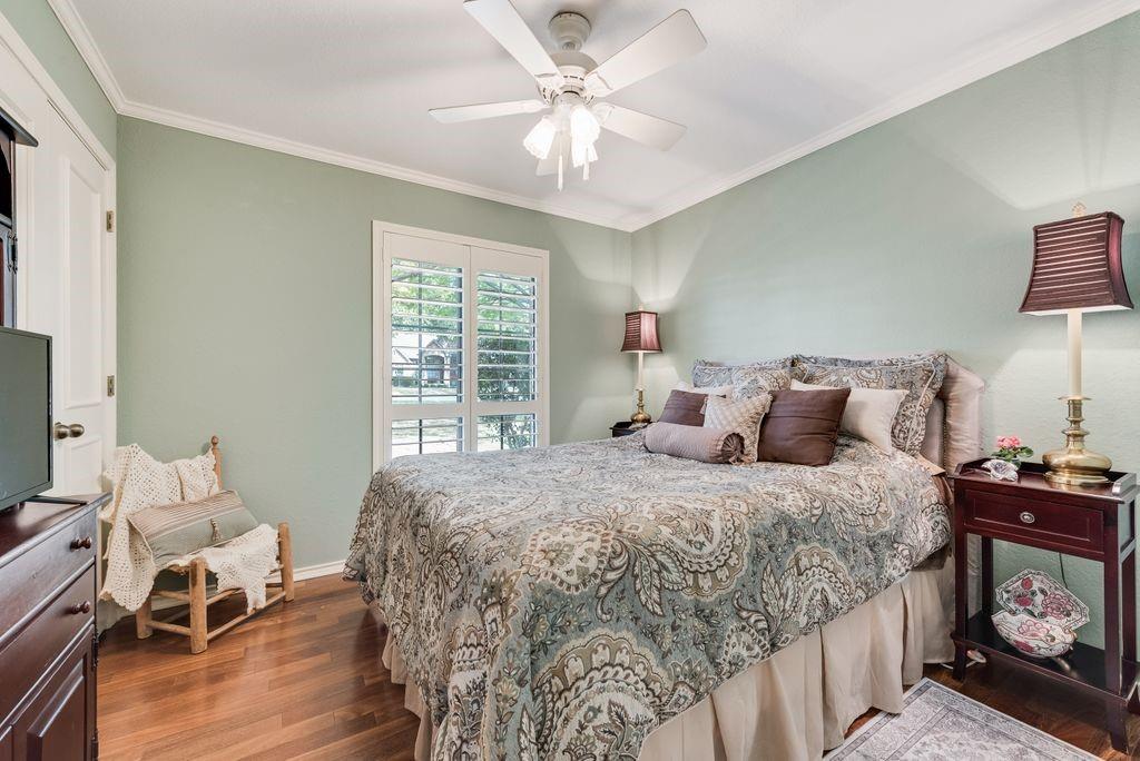 802 Riva Ridge Wylie, TX 75098 - Photo 27 of 39 a bedroom with a bed and a table in it