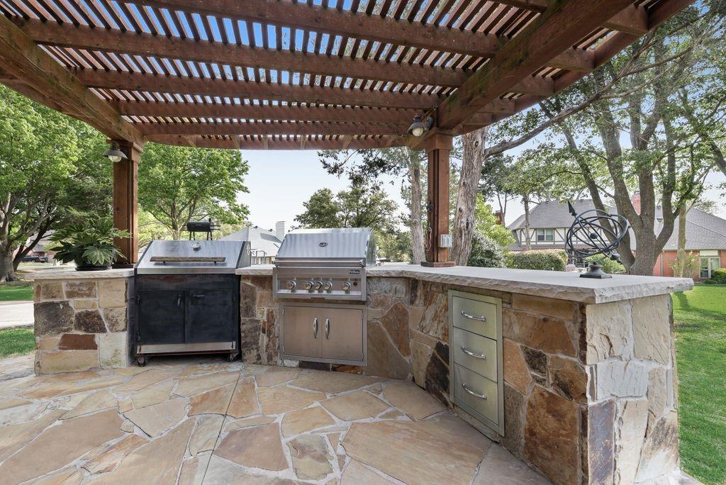 802 Riva Ridge Wylie, TX 75098 - Photo 30 of 39 a view of a chairs and table in the back yard of the house