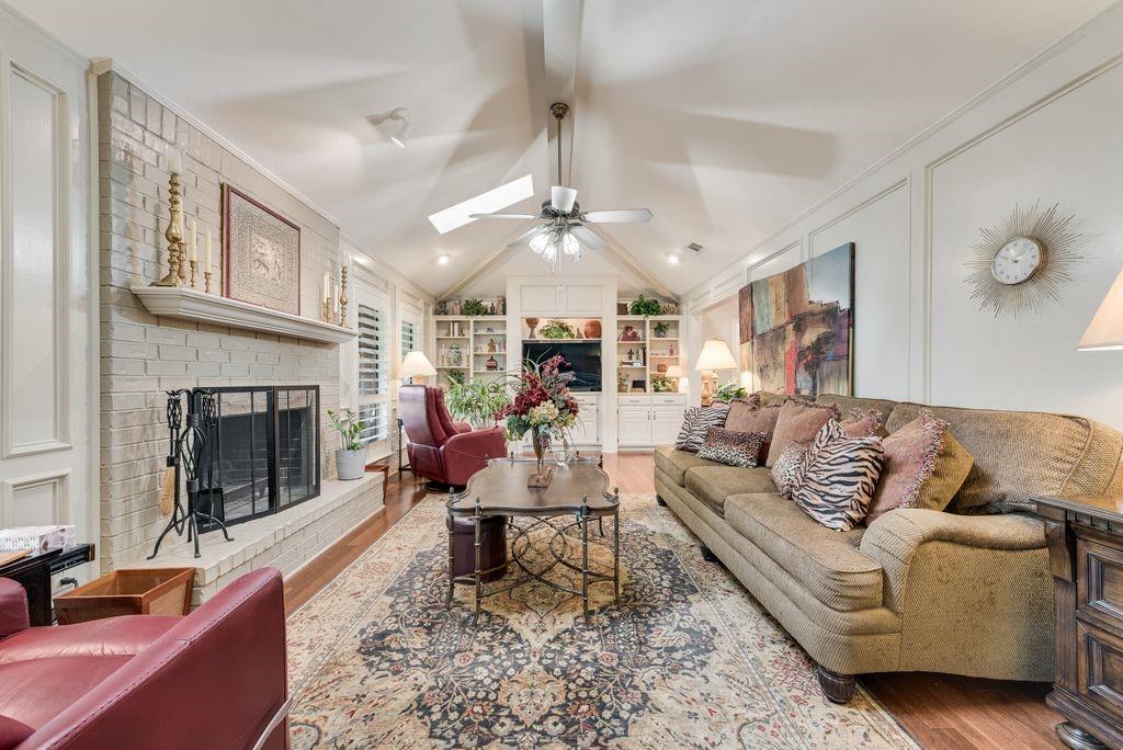 802 Riva Ridge Wylie, TX 75098 - Photo 7 of 39 a living room with furniture fireplace and a chandelier