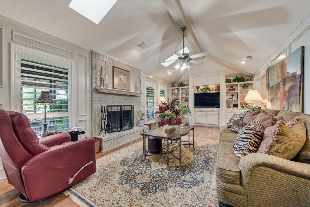 802 Riva Ridge Wylie, TX 75098 - Photo 8 of 39 a living room with furniture a fireplace and a flat screen tv