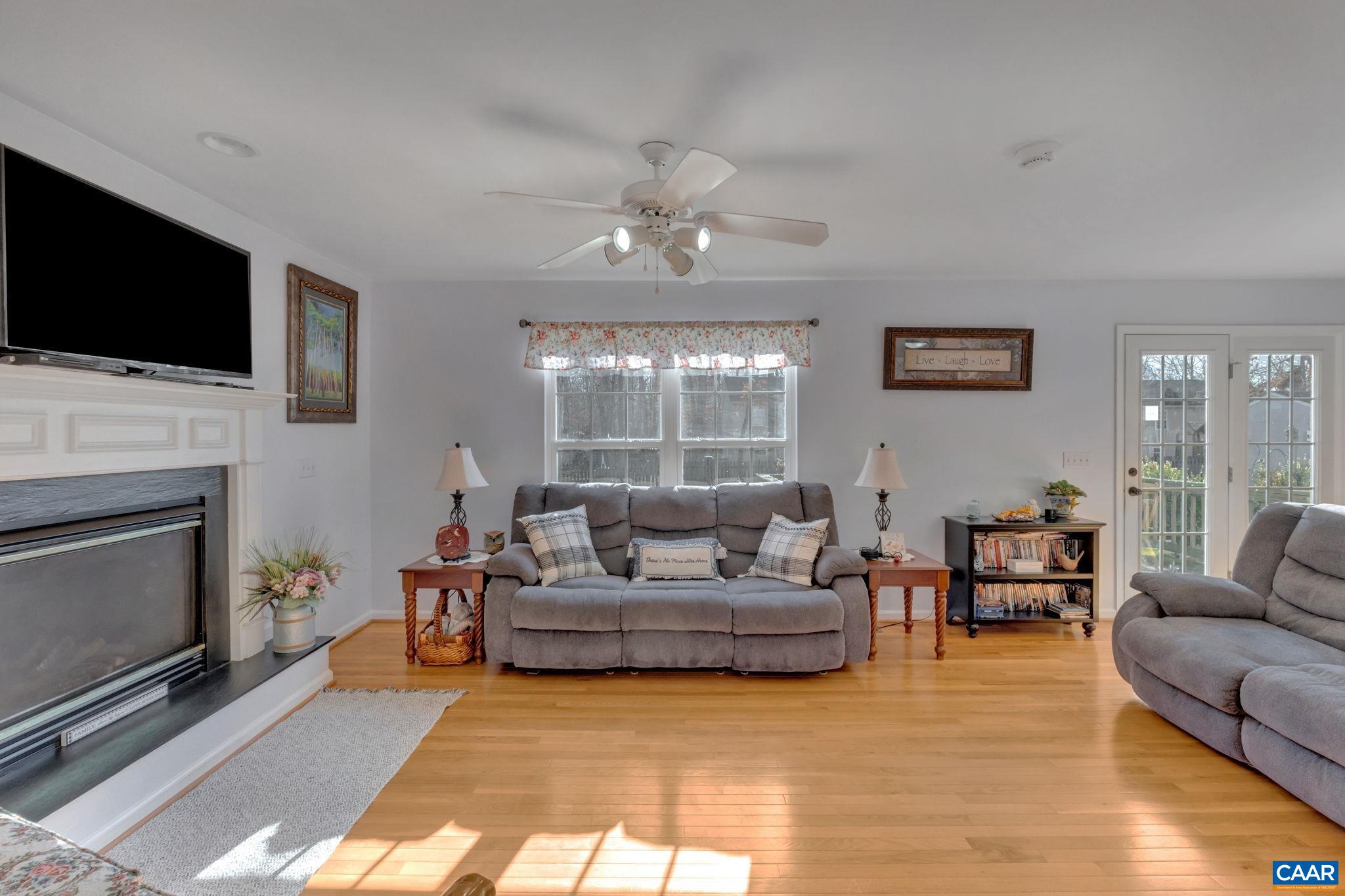 70 Laguna Road Palmyra, VA 22963 - Photo 13 of 33 a living room with furniture fireplace and flat screen tv