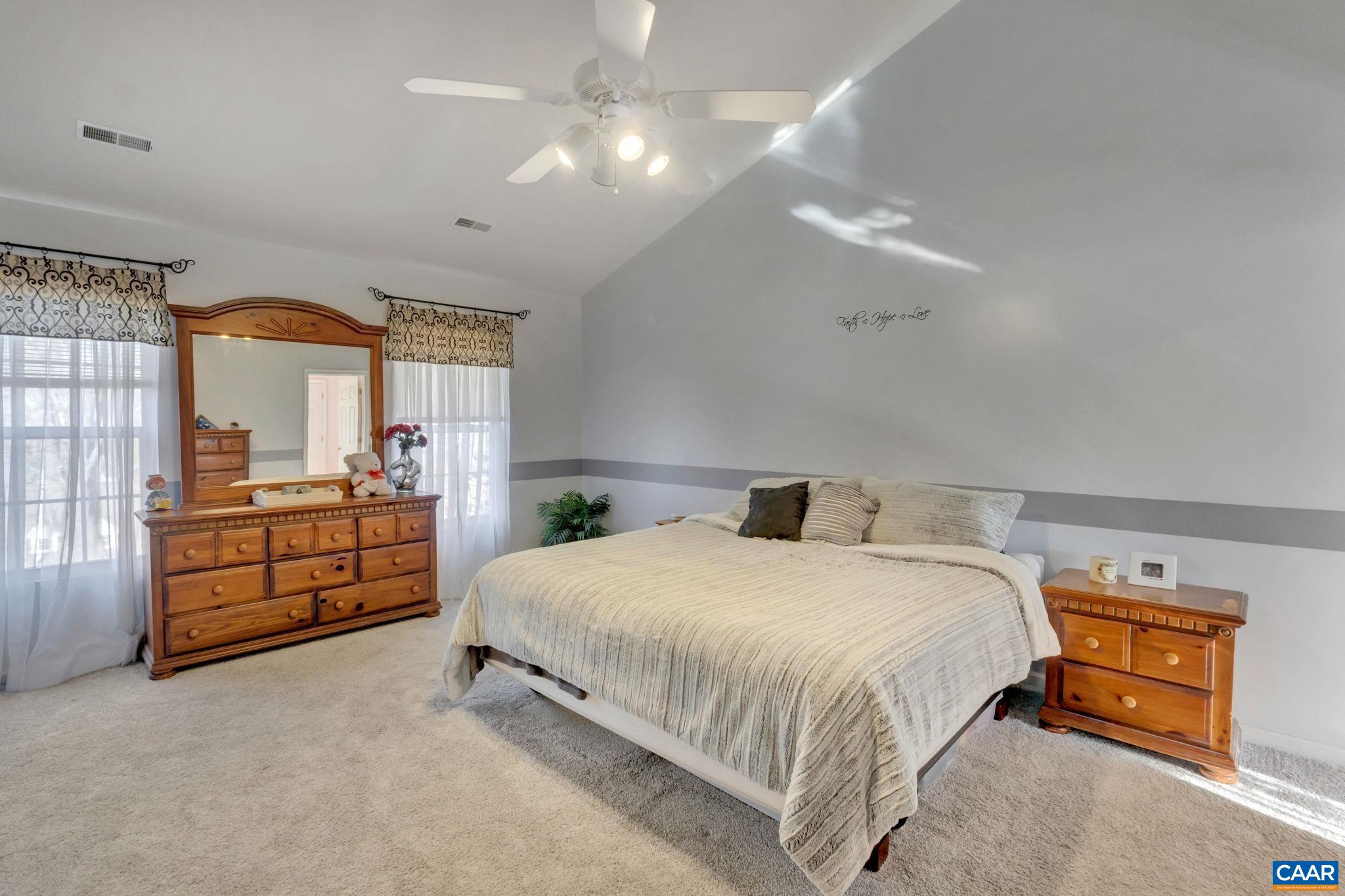 70 Laguna Road Palmyra, VA 22963 - Photo 17 of 33 a bedroom with a bed and a large window