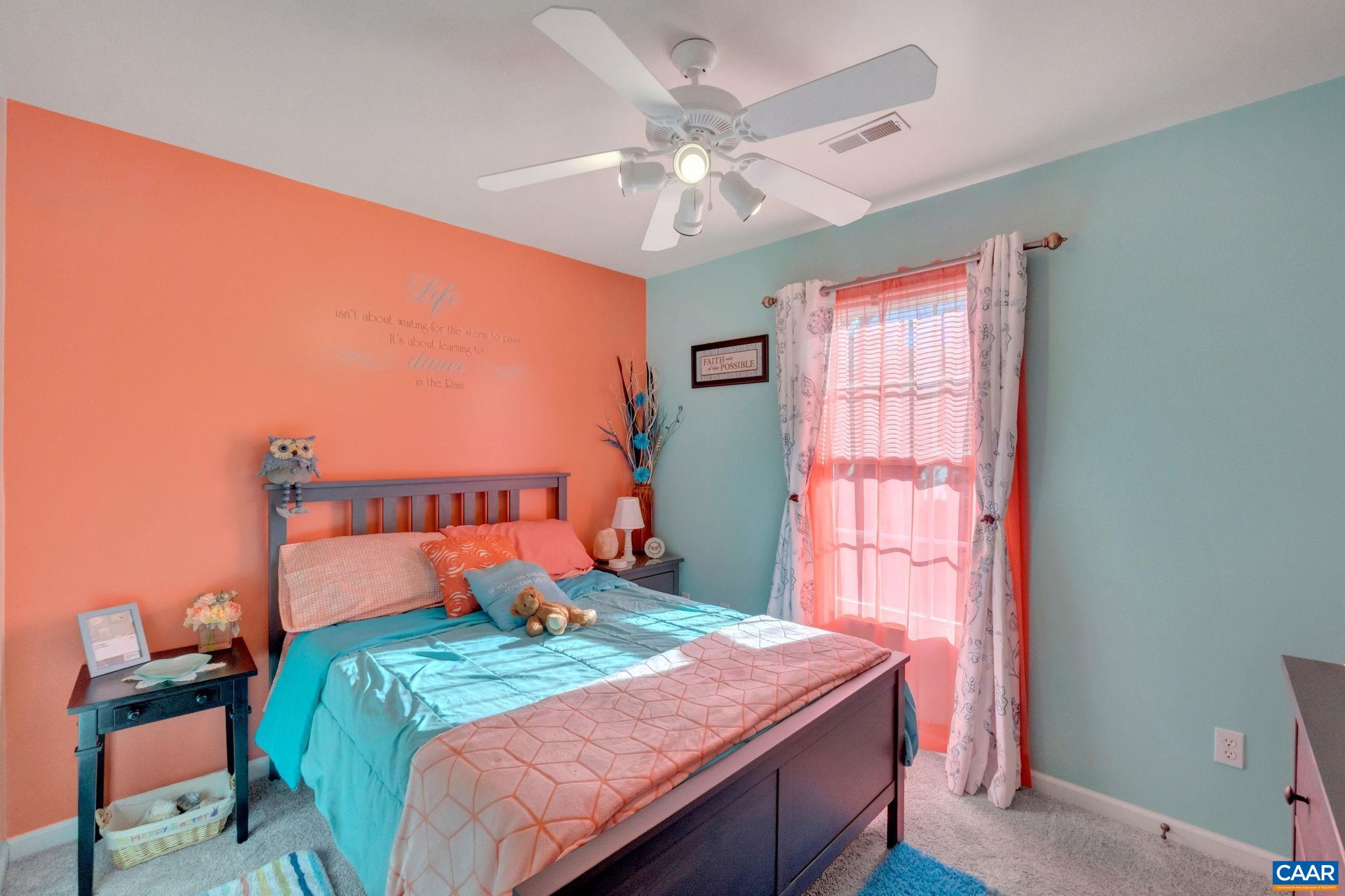70 Laguna Road Palmyra, VA 22963 - Photo 21 of 33 a bedroom with a bed and a chandelier