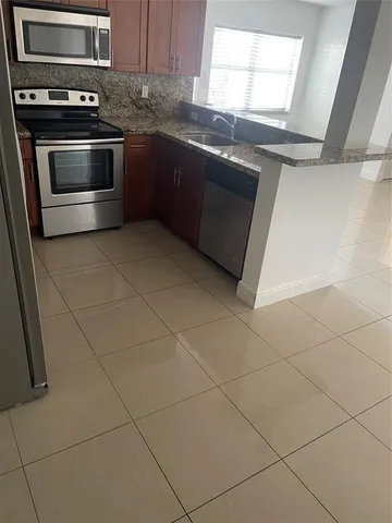 a view of an empty room and entryway