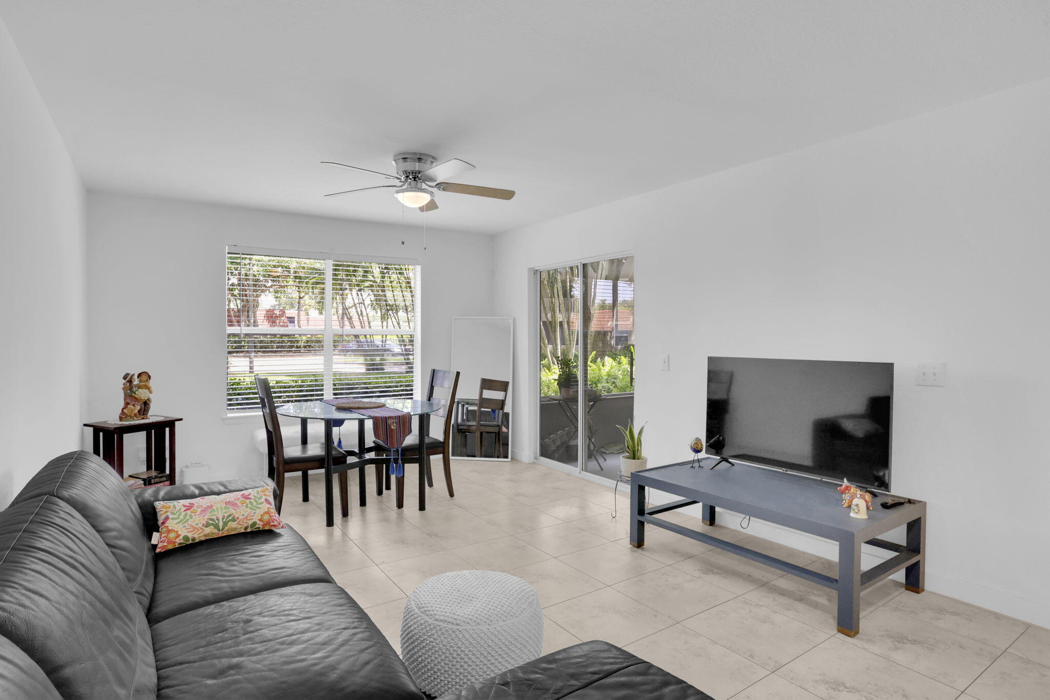 1825 Palm Cove Boulevard, Unit 7102 Delray Beach, FL 33445 - Photo 17 of 19 a living room with furniture and a table