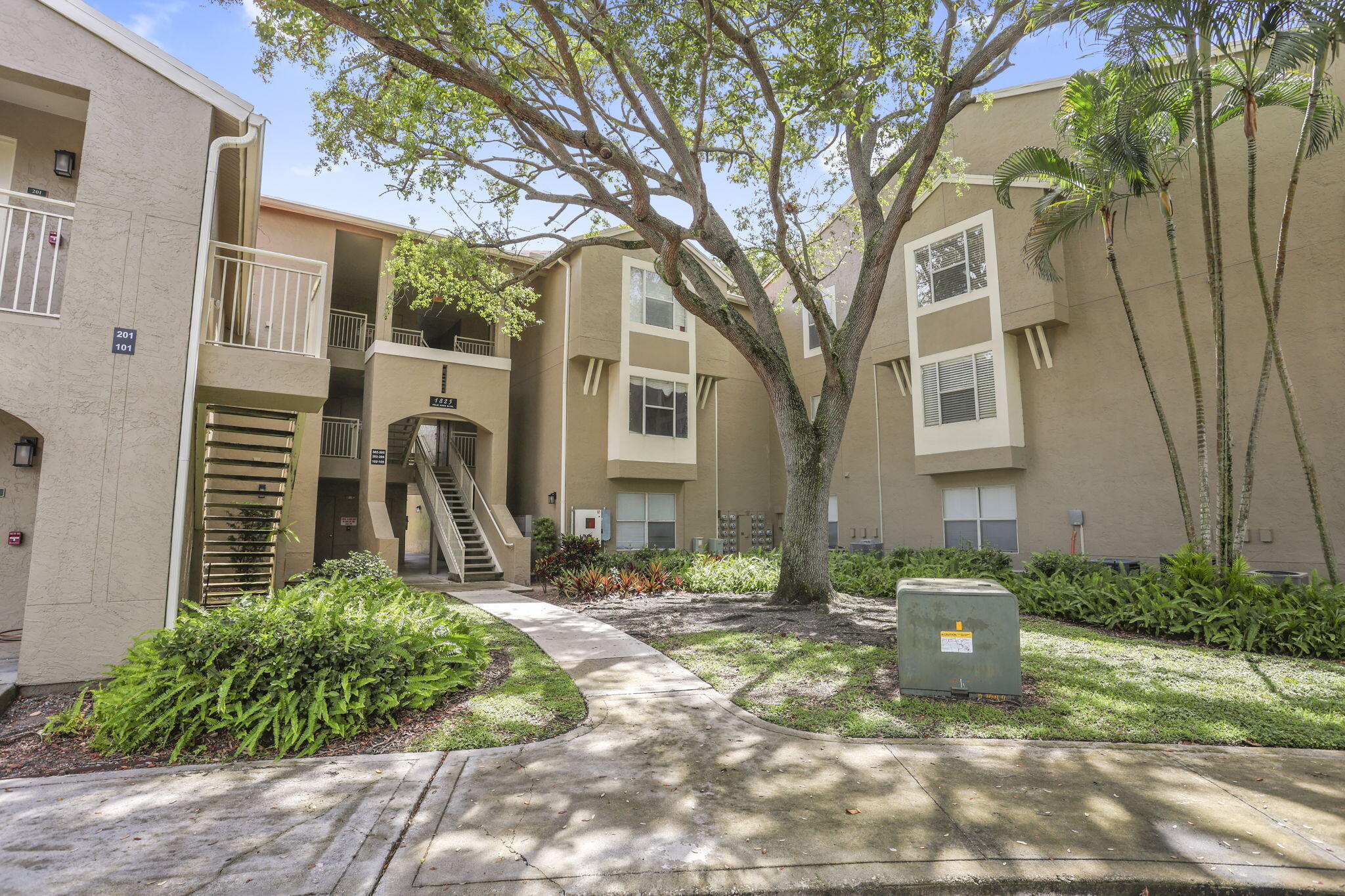 1825 Palm Cove Boulevard, Unit 7102 Delray Beach, FL 33445 - Photo 2 of 19 a view of a house with a yard