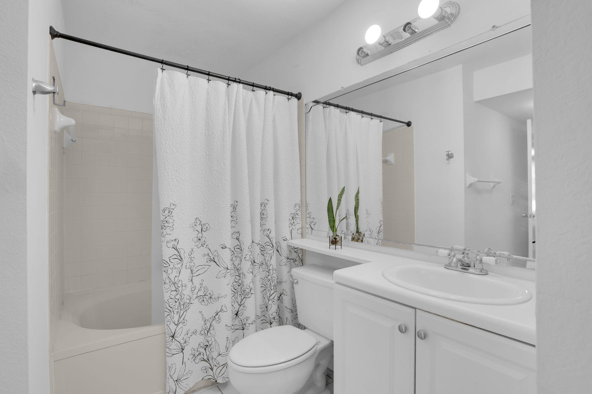 1825 Palm Cove Boulevard, Unit 7102 Delray Beach, FL 33445 - Photo 7 of 19 a bathroom with a sink a toilet and shower