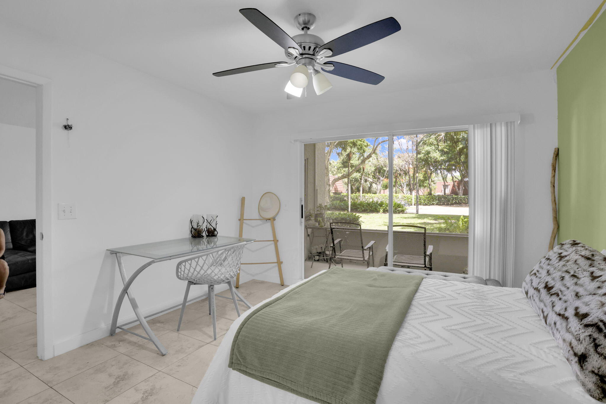 1825 Palm Cove Boulevard, Unit 7102 Delray Beach, FL 33445 - Photo 9 of 19 a bed room with a bed and a chair