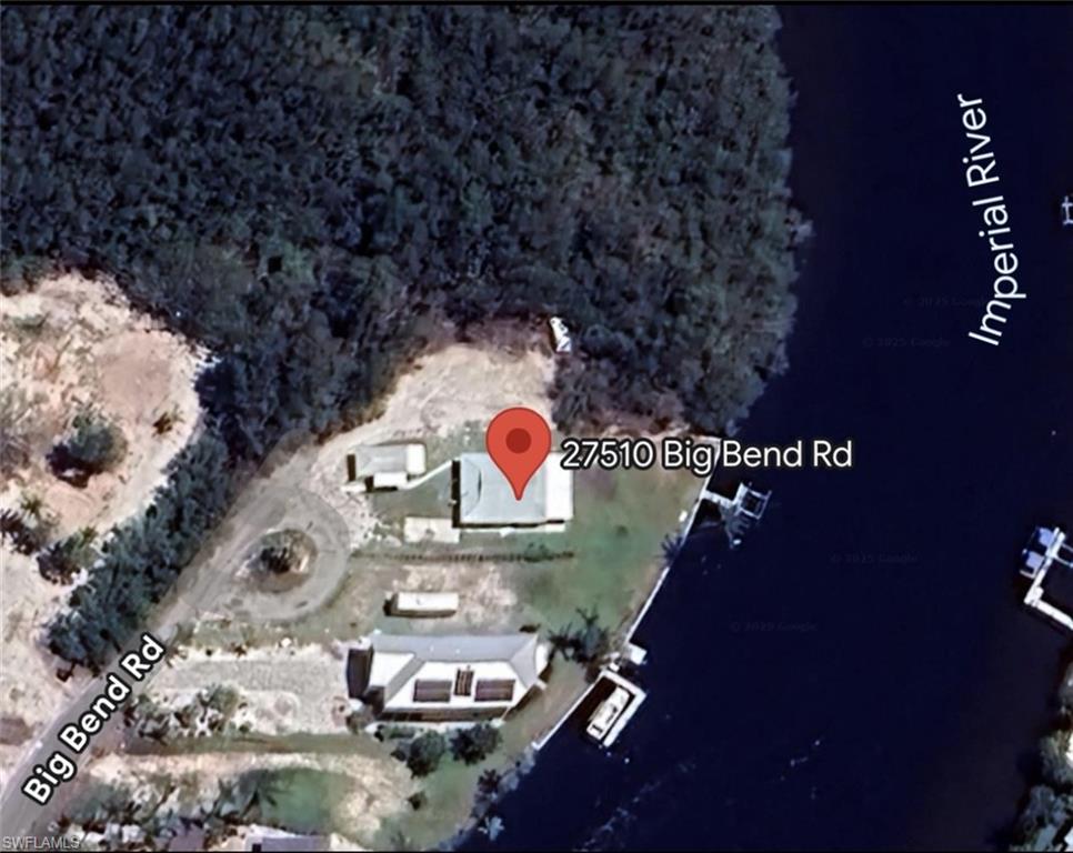 27510 Big Bend Road Bonita Springs, FL 34134 - Photo 13 of 23 a table with chairs and a stove