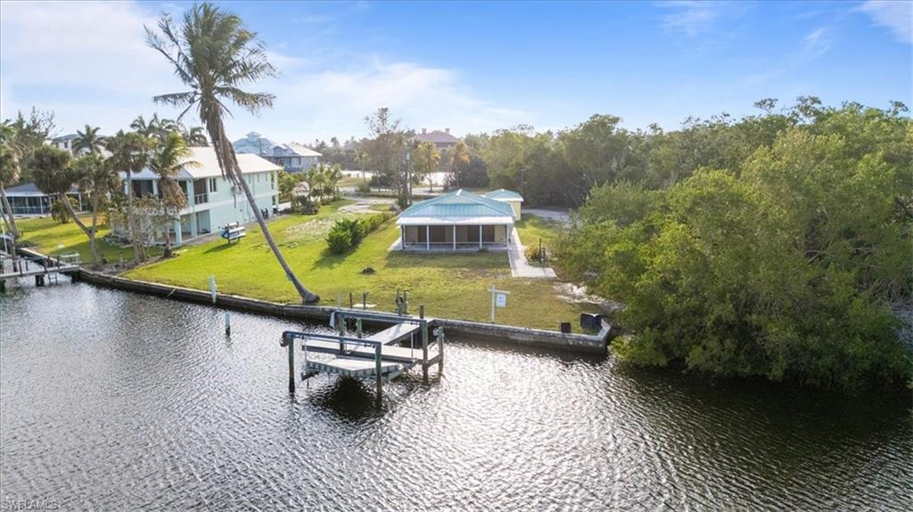 27510 Big Bend Road Bonita Springs, FL 34134 - Photo 18 of 23 a swimming pool with outdoor seating and yard