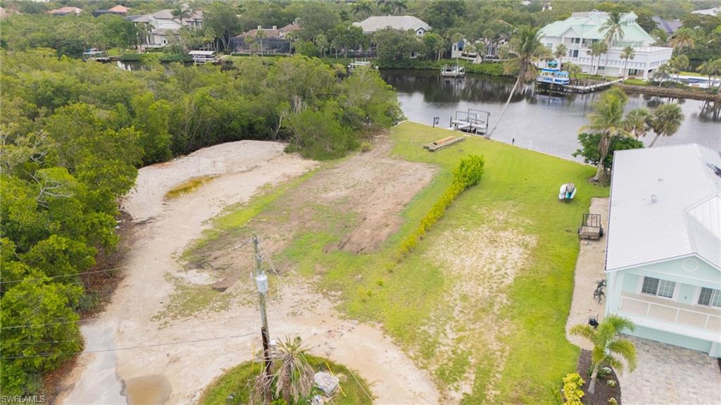 27510 Big Bend Road Bonita Springs, FL 34134 - Photo 19 of 23 a view of a swimming pool with a lake view
