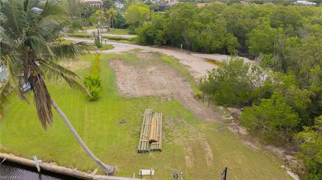 an aerial view of a residential house with outdoor space