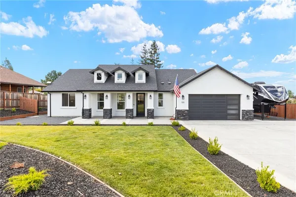 a front view of a house with a yard