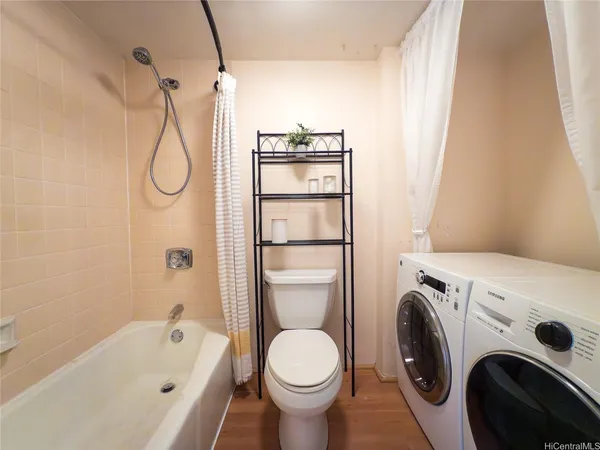 a bathroom with a sink a toilet and a bathtub