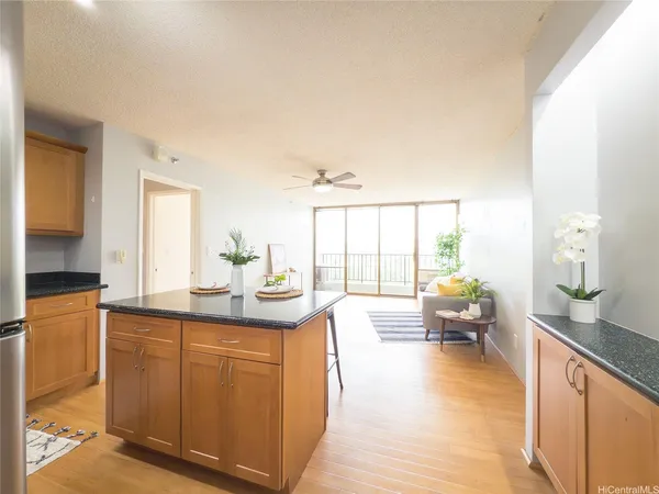a spacious bathroom with a granite countertop sink and a large mirror