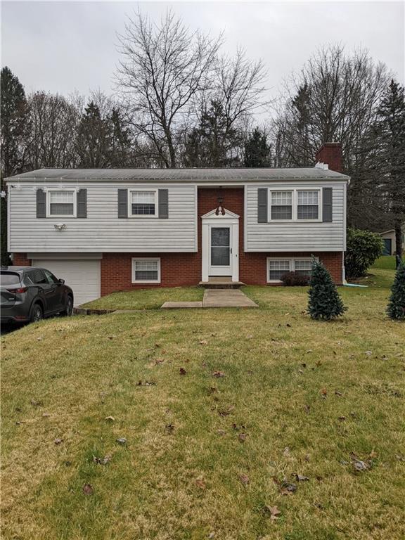 223 S Trail Butler, PA 16002 - Photo 1 of 24 a front view of a house with a yard