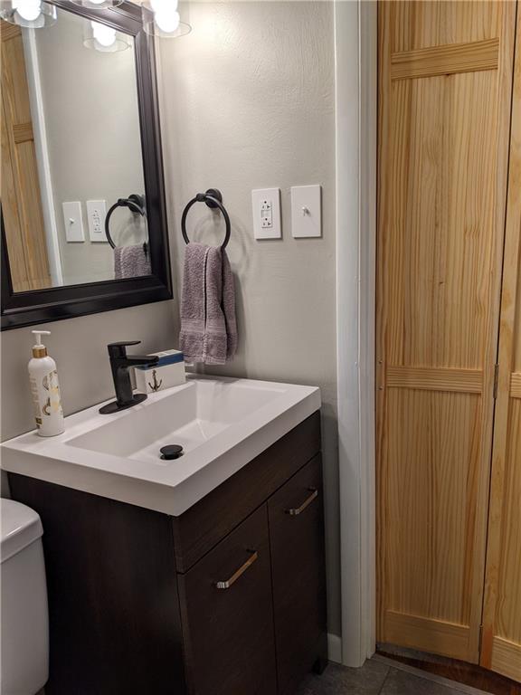 223 S Trail Butler, PA 16002 - Photo 11 of 24 a bathroom with a sink vanity and a mirror