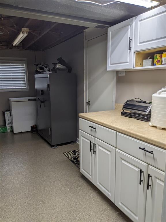 223 S Trail Butler, PA 16002 - Photo 17 of 24 a kitchen with cabinets and white appliances