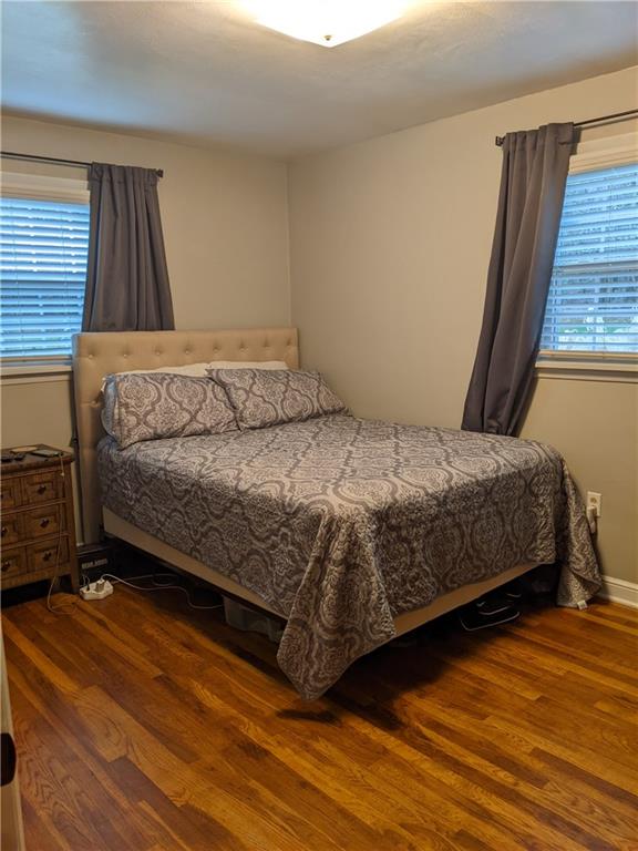 223 S Trail Butler, PA 16002 - Photo 7 of 24 a bedroom with a bed and wooden floor