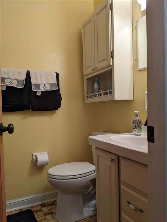 223 S Trail Butler, PA 16002 - Photo 9 of 24 a bathroom with a sink a toilet and mirror